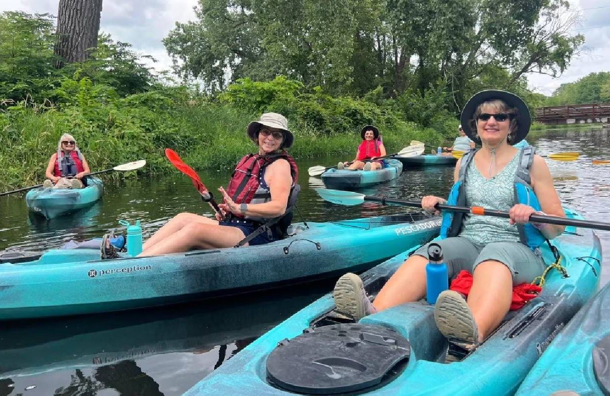 People kayaking on a river. Next Avenue, retirees