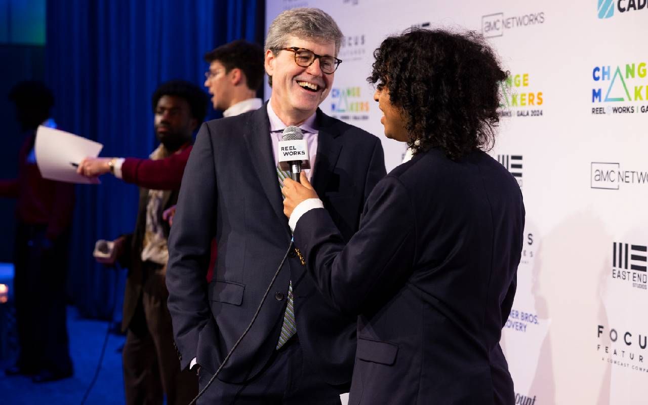 A man being interviewed at a film premiere. Next Avenue, second act