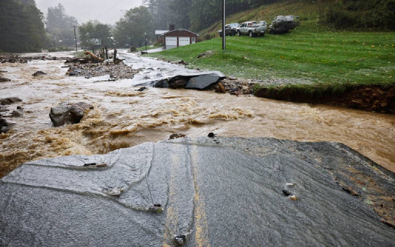 Flood water and a damaged road. Next Avenue, climate change