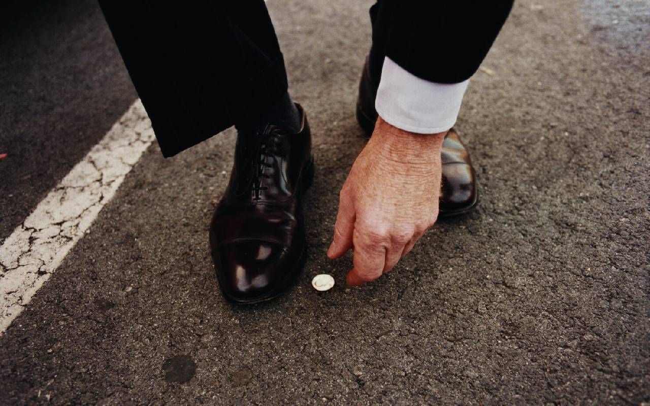 A man finding a coin on the street. Next Avenue, gratitude