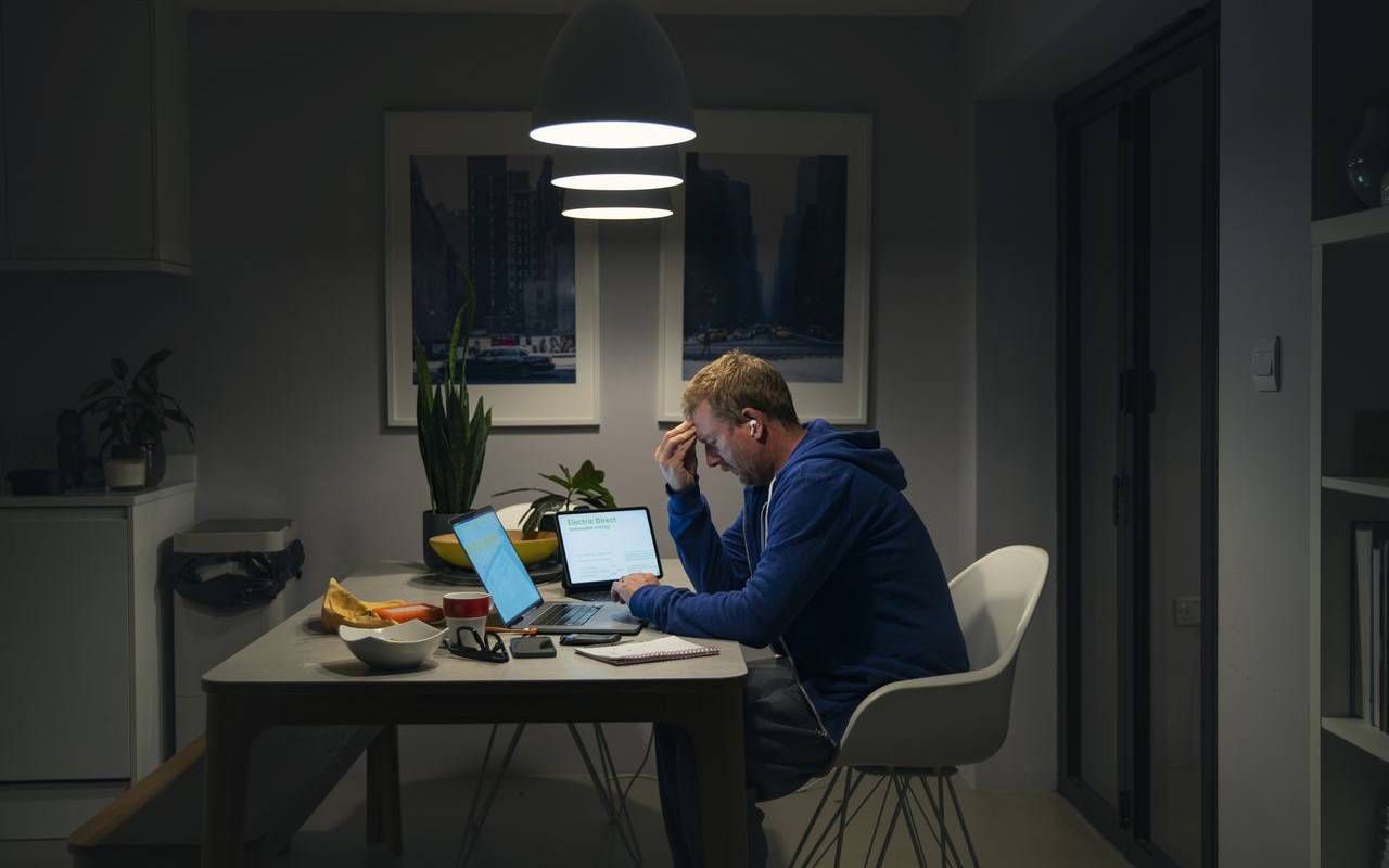 A person stressed out by credit card debt. Next Avenue