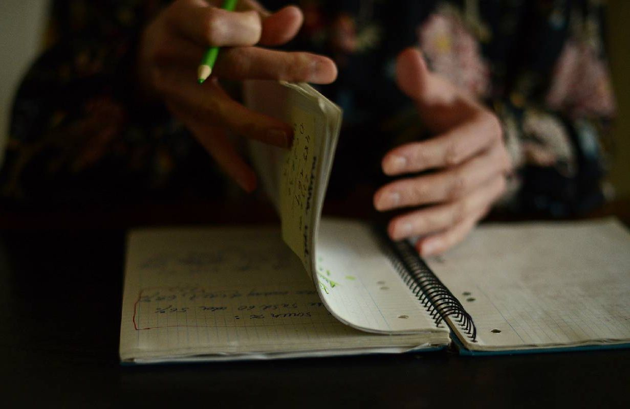A person paging through their journal. Next Avenue, coping with chronic illness