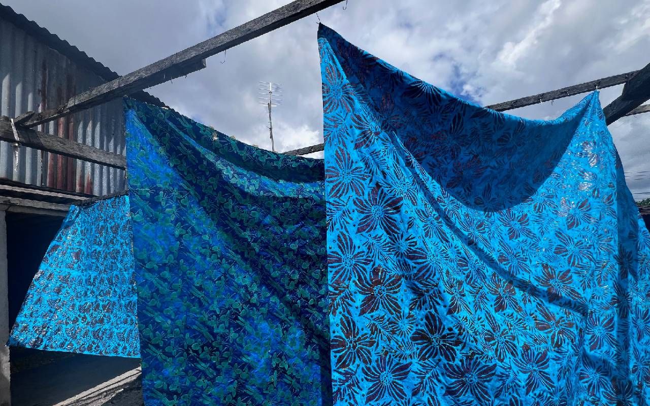 Batiked fabrics drying outside. Next Avenue, batik
