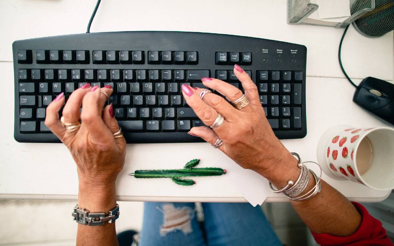 A person updating their resume. Next Avenue, job hunting, retirement, AI