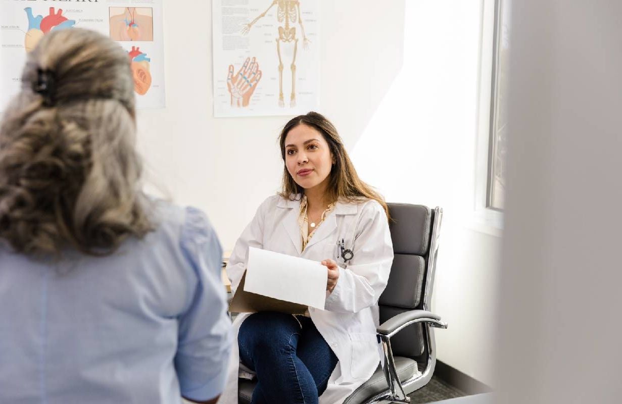 A patient talking to their doctor. Next Avenue