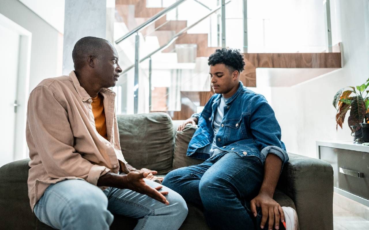 A parent talking to their adult child about co-signing a loan. Next Avenue