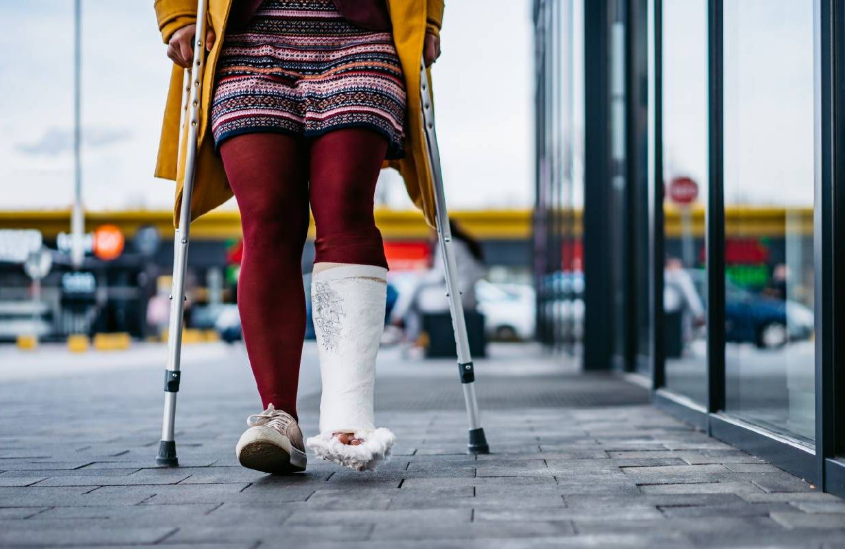 Woman walking with cast on foot. Next Avenue