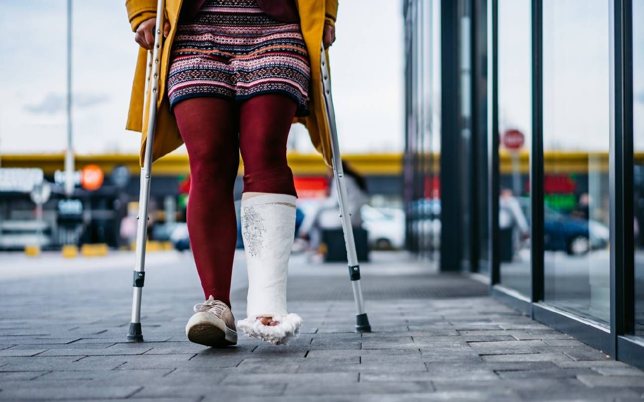 Woman walking with cast on foot. Next Avenue