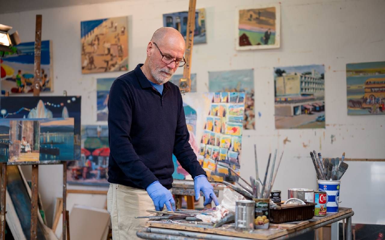 An older man who teaches a painting class. Next Avenue