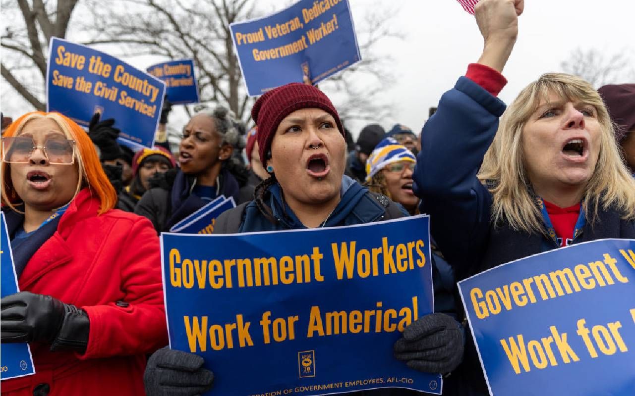 Members of the American Federation of Government Employees union protest against firings during a rally to defend federal workers in Washington, DC, on February 11, 2025. Next Avenue, federal employees,