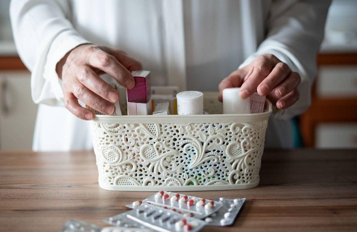 A person sorting through their at home medical kit. Next Avenue, DIY medical test home kits