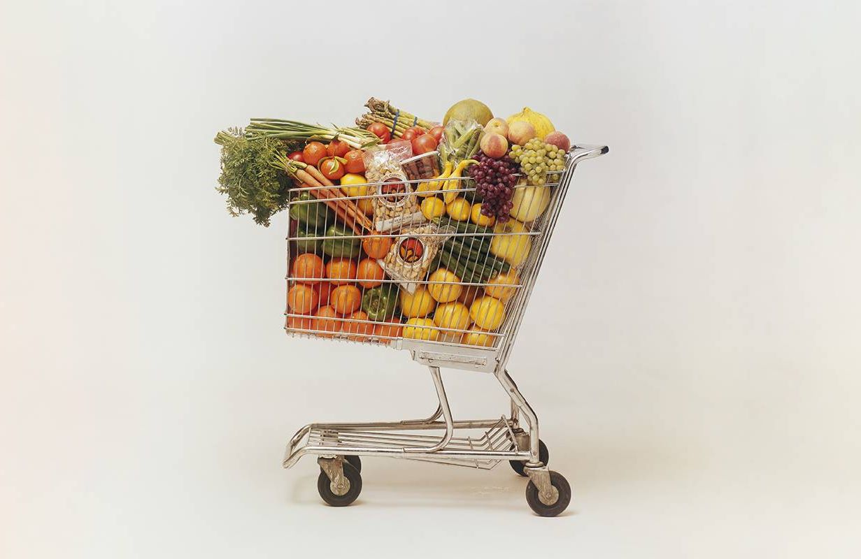 A grocery cart overfilled with groceries. Next Avenue, on-demand culture