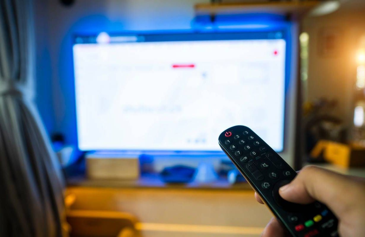 A person turning off their TV. Next Avenue, subscriptions