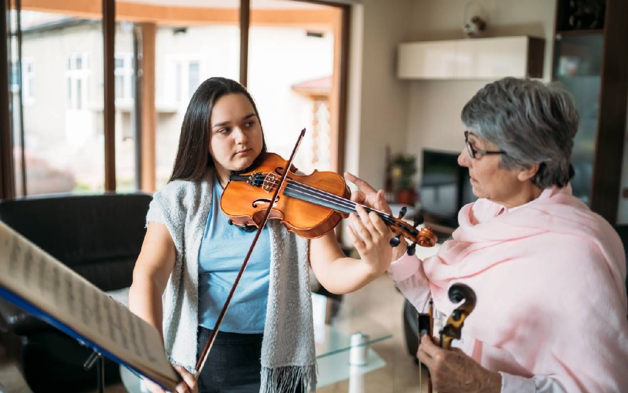 An unretired older adult teaching music lessons. Next Avenue, unretirement