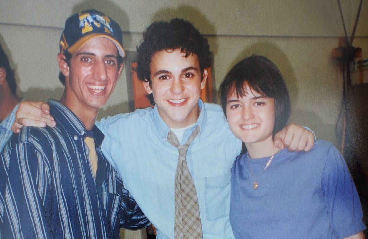 Three people smiling together. Next Avenue, Danica McKellar