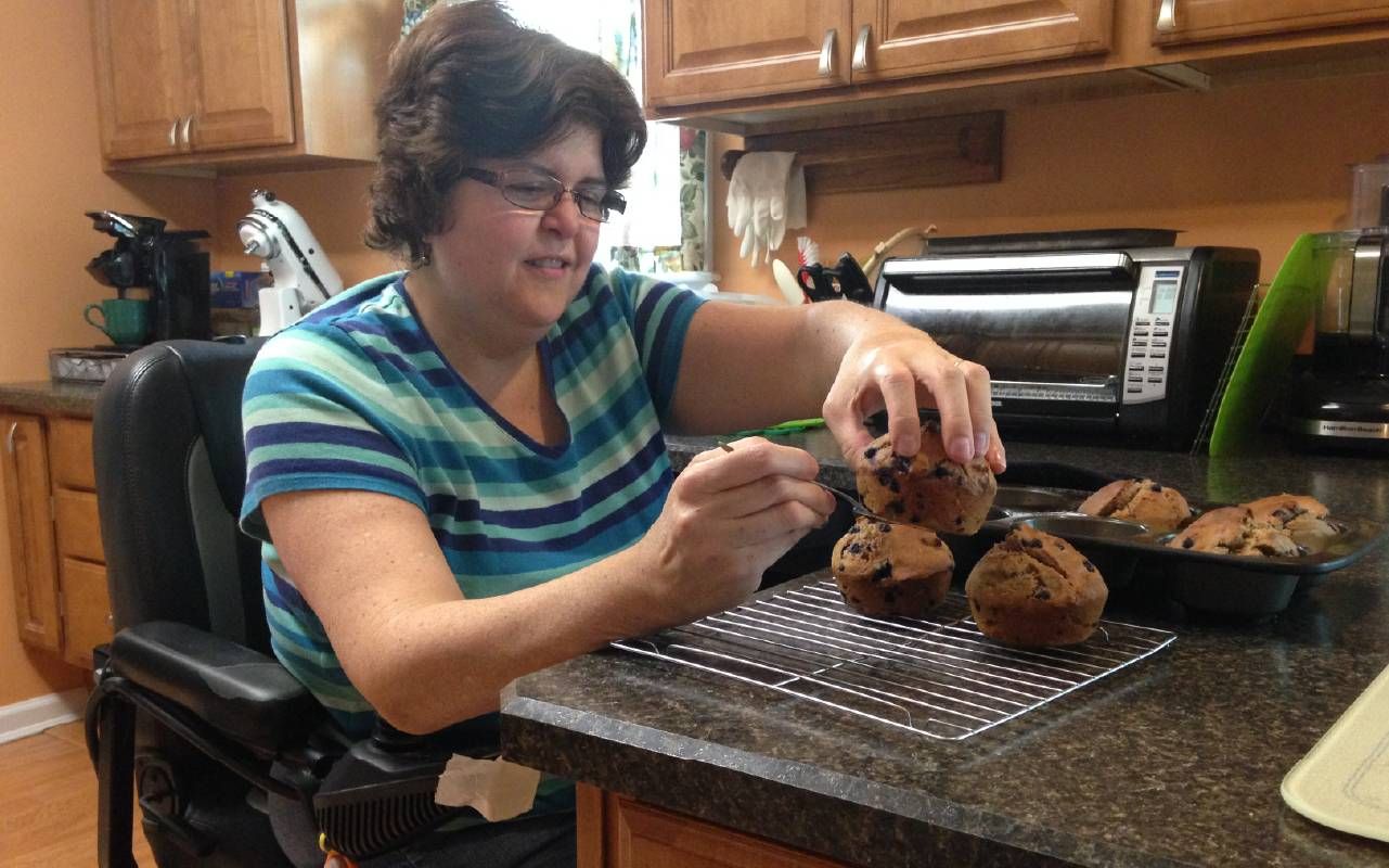 A person cooking in a kitchen. Next Avenue, accessibility, kitchens