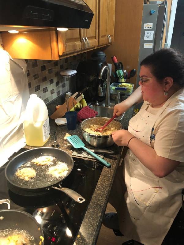 A person cooking in a kitchen. Next Avenue, accessibility, kitchens