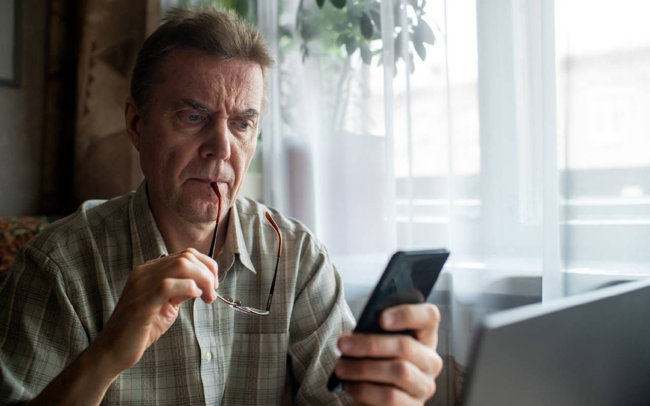 A man looking confused while reading his medical records. Next Avenue