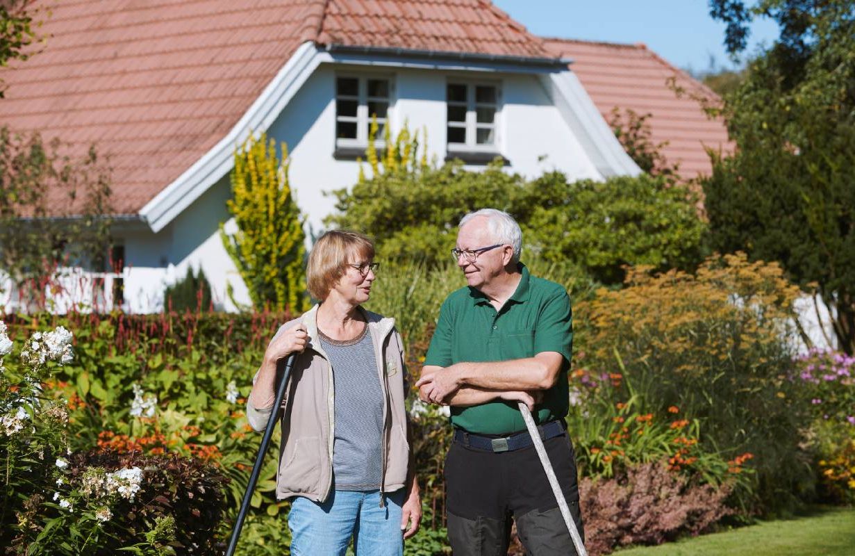 Two gardeners standing in a garden. Next Avenue, retirement, transition
