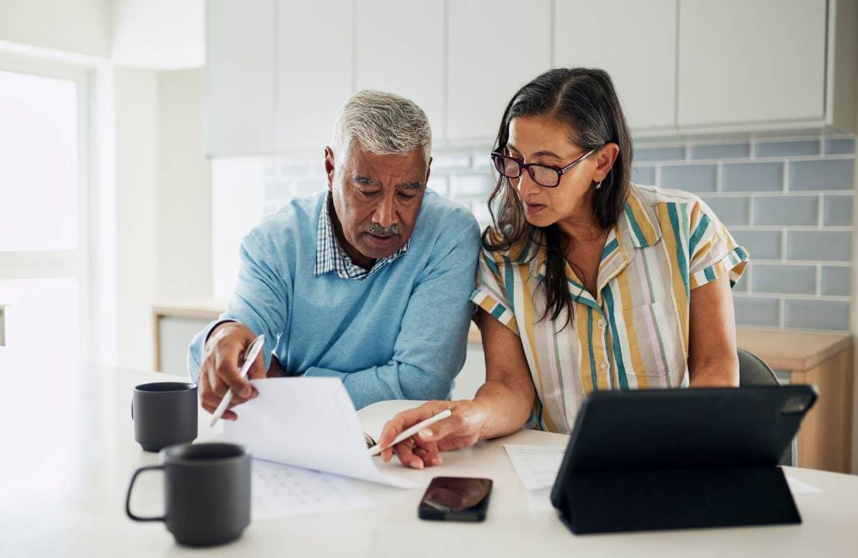 A retired couple doing their taxes. Next Avenue, retirement, taxes