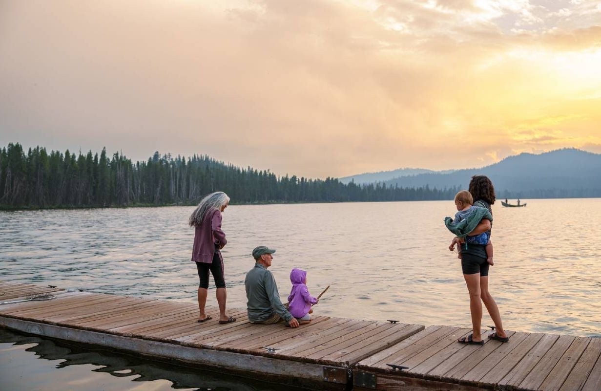 A family fishing off a dock at the lake. Next Avenue, seasonal work, retirement