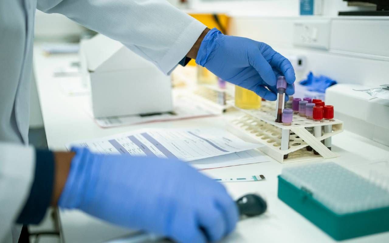 A researcher performing a blood test. Next Avenue, lymphoma, blood test, study