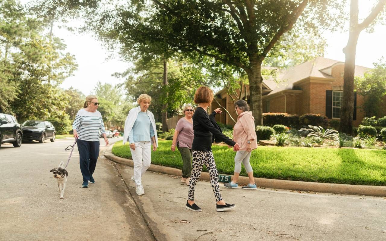 A group people walking together in their neighborhood. Next Avenue, brain health