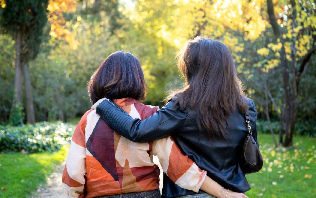 A mother and daughter walking together. Next Avenue, no grandchildren, infertility, fertility