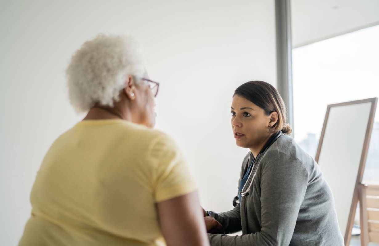 A woman talking to her doctor. Next Avenue, cervical cancer