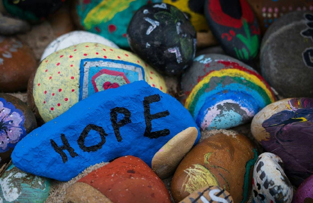 Colorful painted rocks. Next Avenue, hope, change