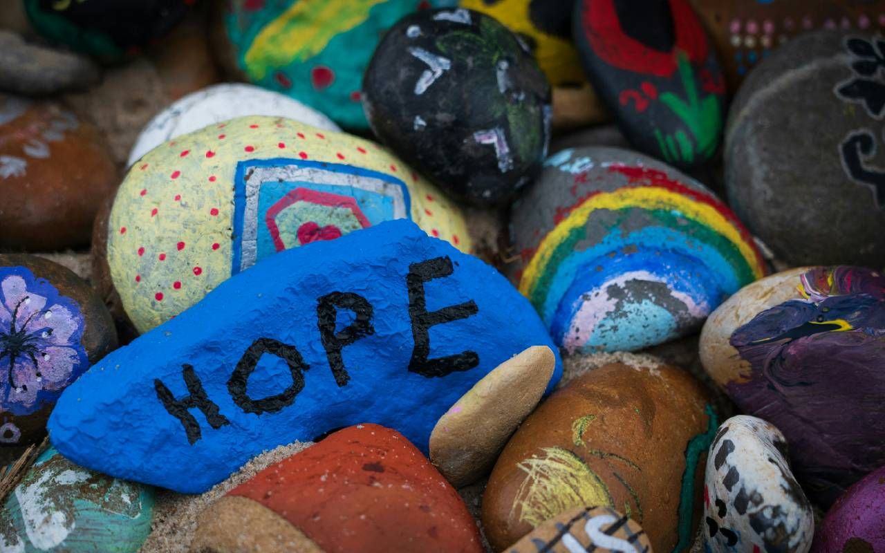 Colorful painted rocks. Next Avenue, hope, change