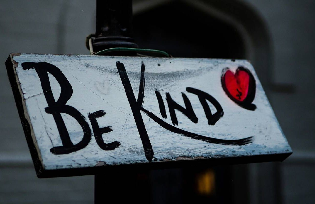 A sign that reads, 'be kind'. Next Avenue, kindness, social media