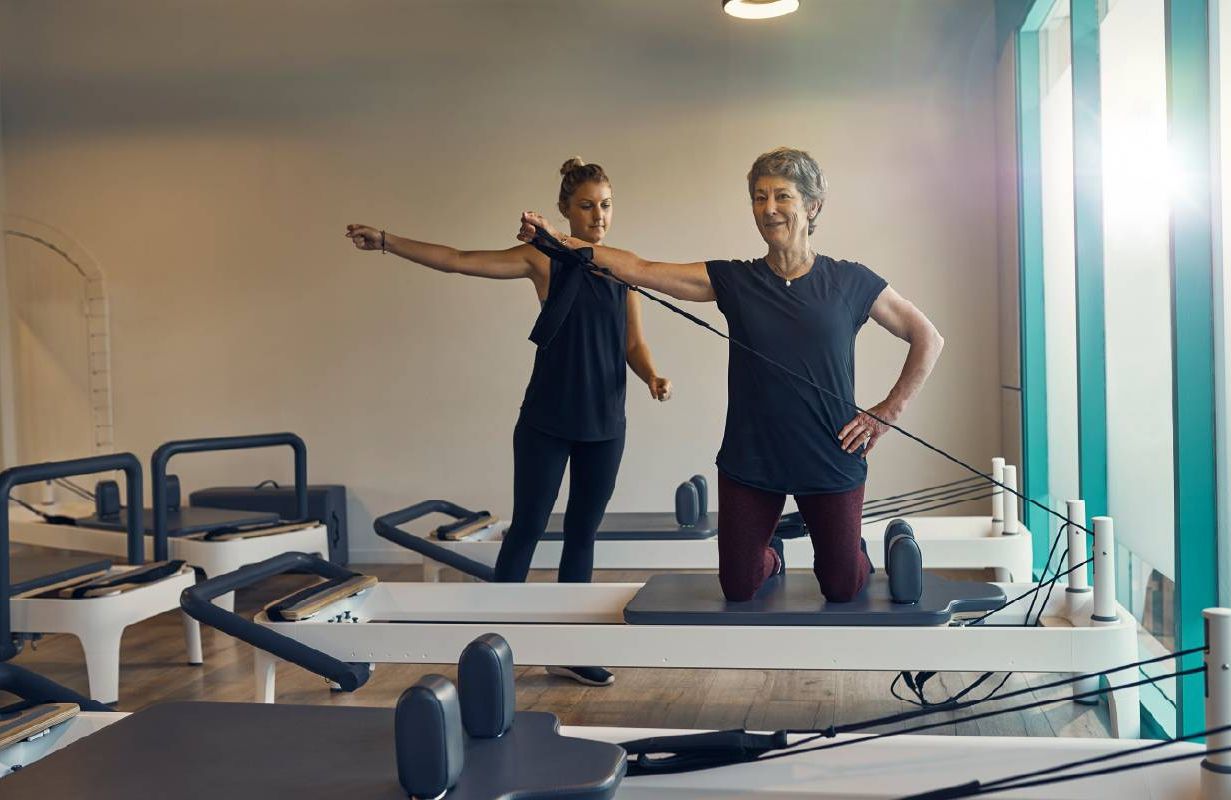 A woman taking a fitness class. Next Avenue, bone density, strength training, osteoporosis