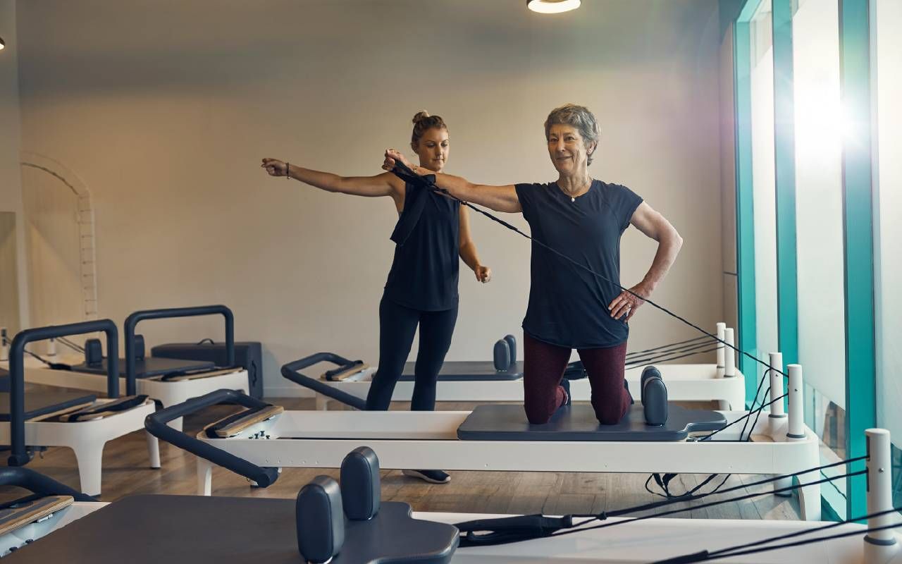A woman taking a fitness class. Next Avenue, bone density, strength training, osteoporosis
