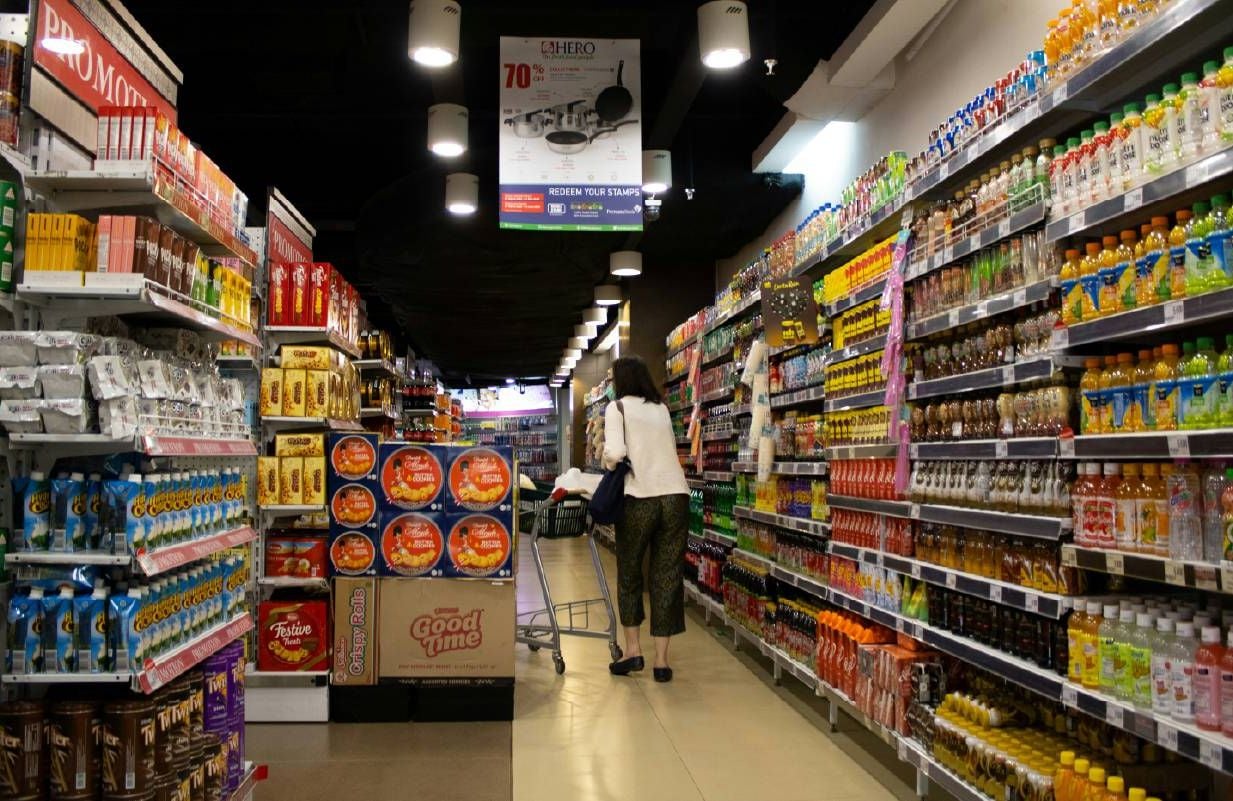 Person shopping at a grocery store. Next Avenue, protein, older adults