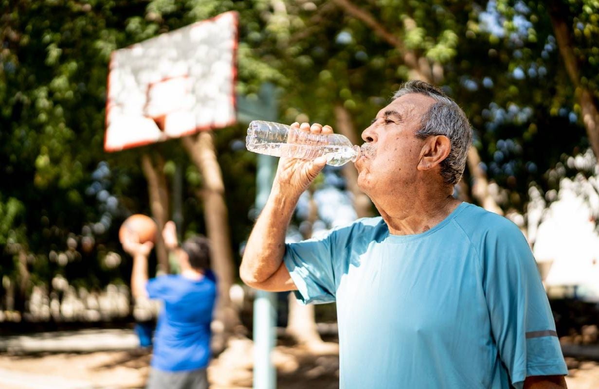 A person drinking water. Next Avenue, medication, heat intolerance