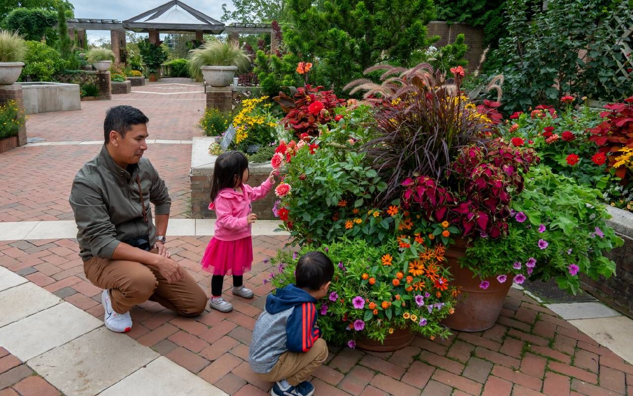 Visitors enjoying the containers in Buehler Enabling Garden. Next Avenue, accessible gardening