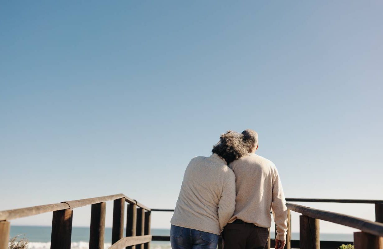A retired couple leaning on each other. Next Avenue