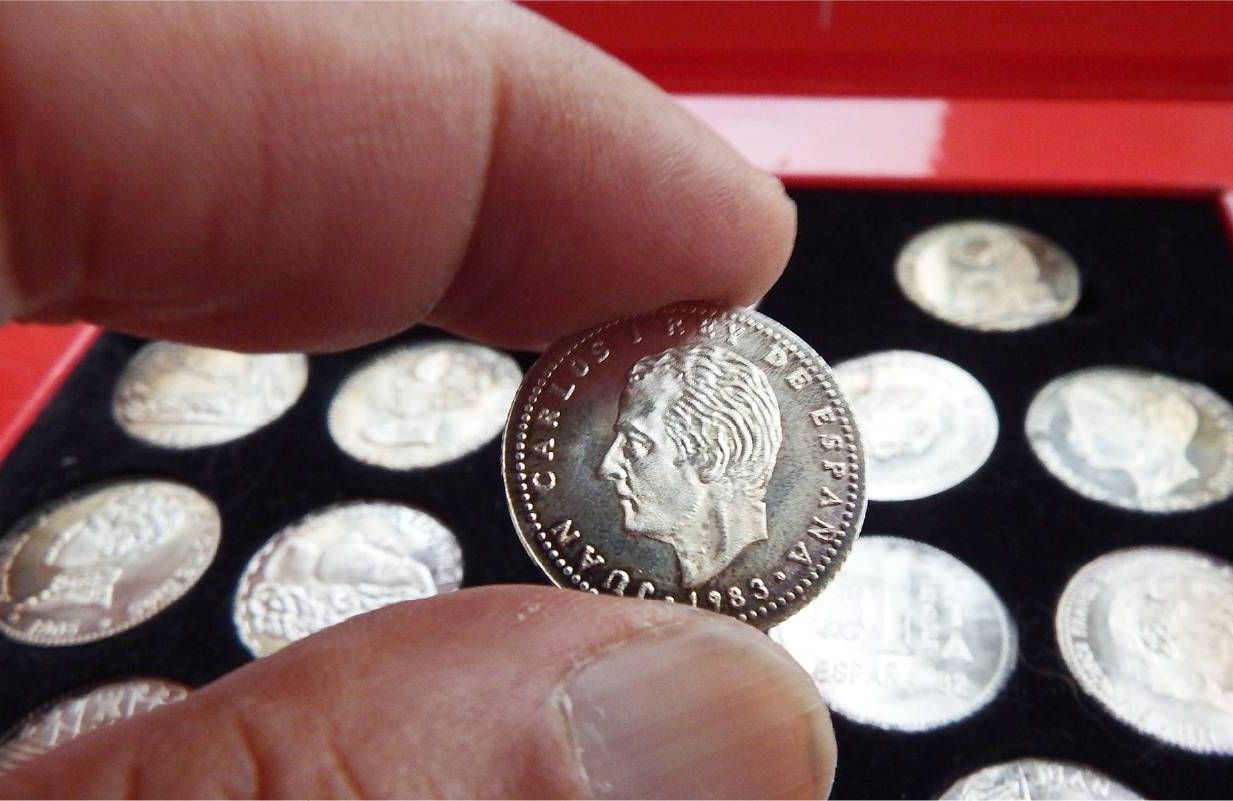 A person showing their coin collection. Next Avenue, investing