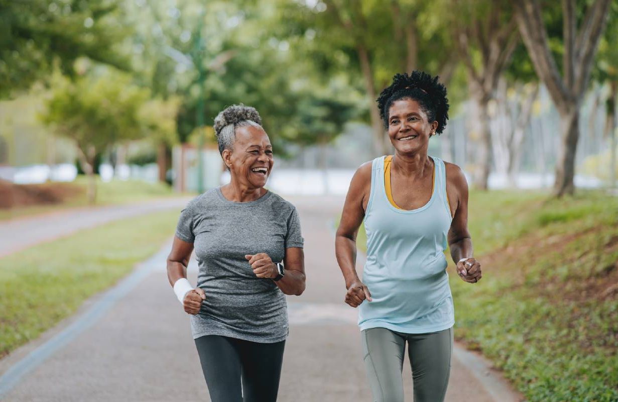 Two women exercising together. Next Avenue, breast cancer