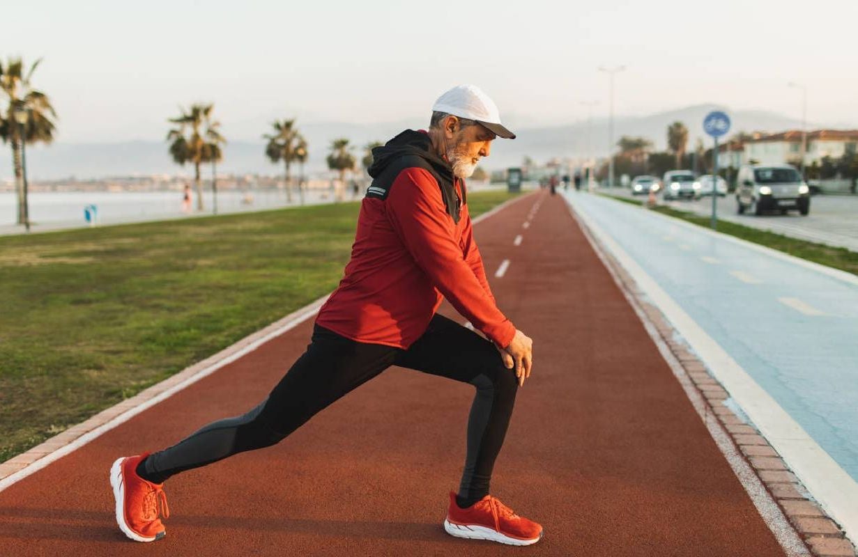 A person doing lunges outside. Next Avenue