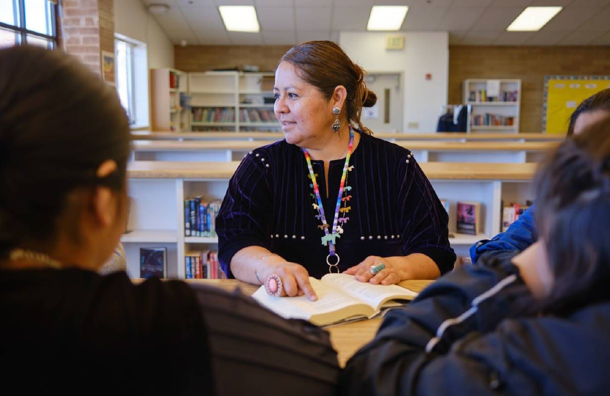 A teacher helping students. Next Avenue, substitute teaching, retirement