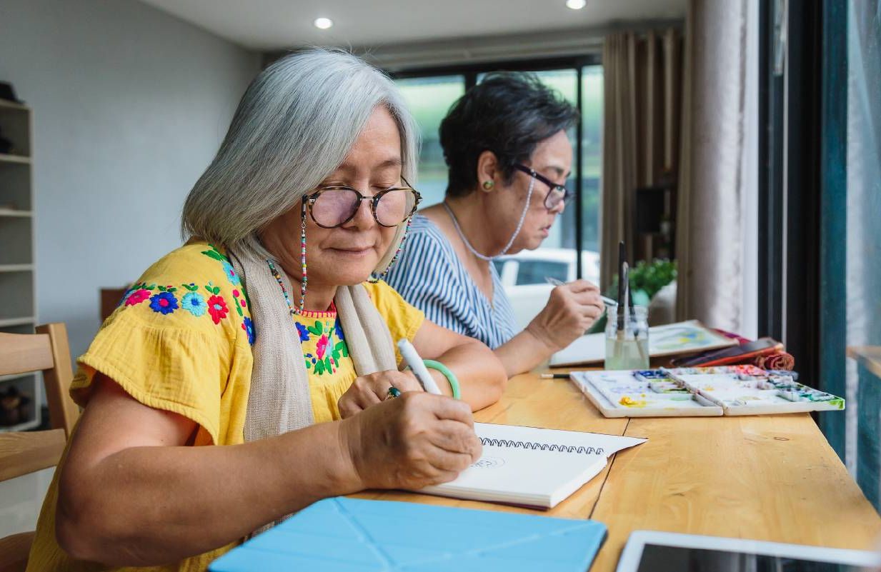 Two older students completing work for a lifelong learning course. Next Avenue, continuing education, longevity