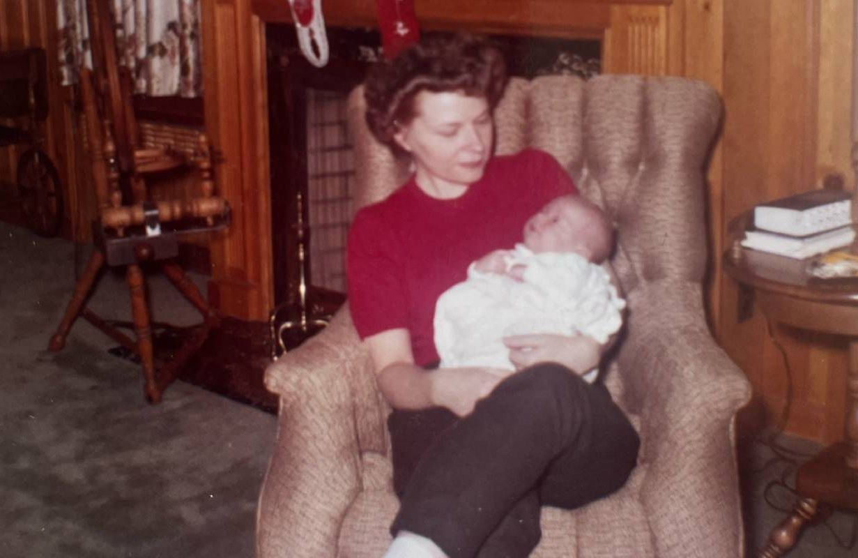 An old photo of a mother holding a baby. Next Avenue, WWII Heroines
