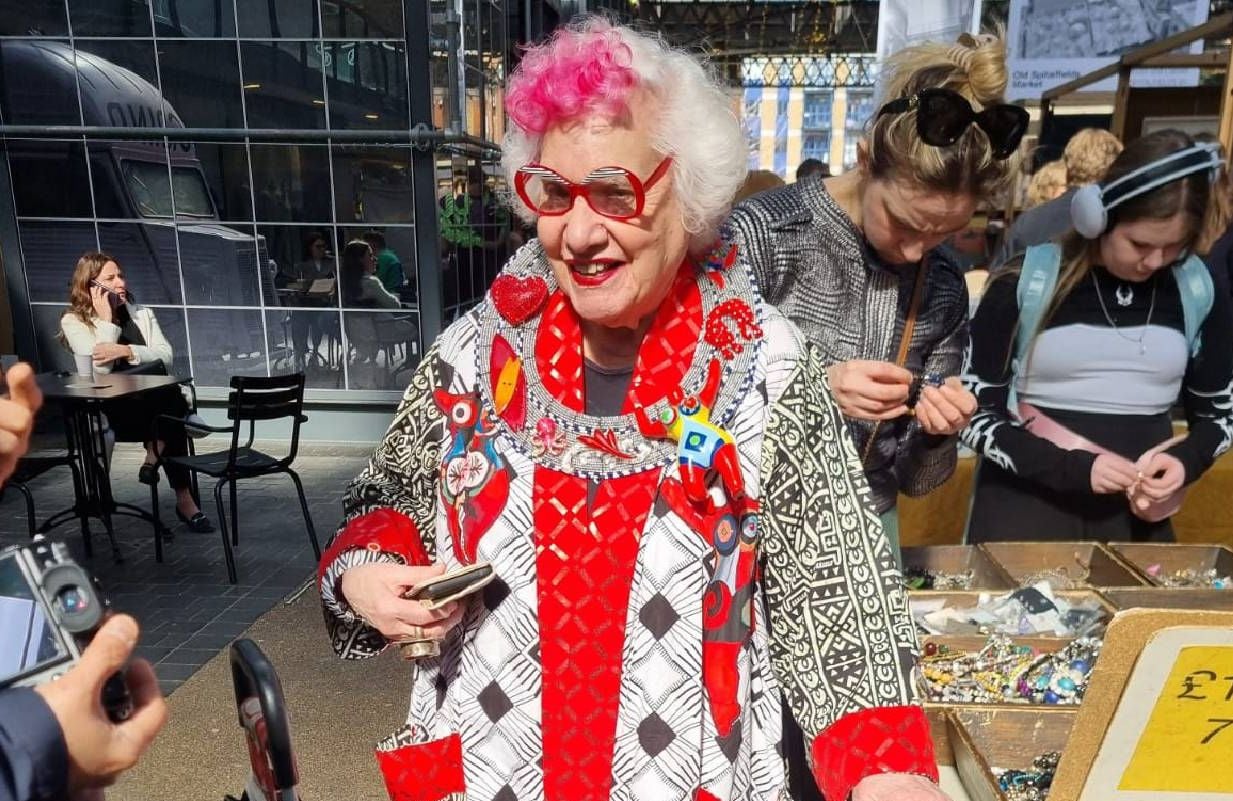 An older woman wearing eclectic fashion outside. Next Avenue, outsider art