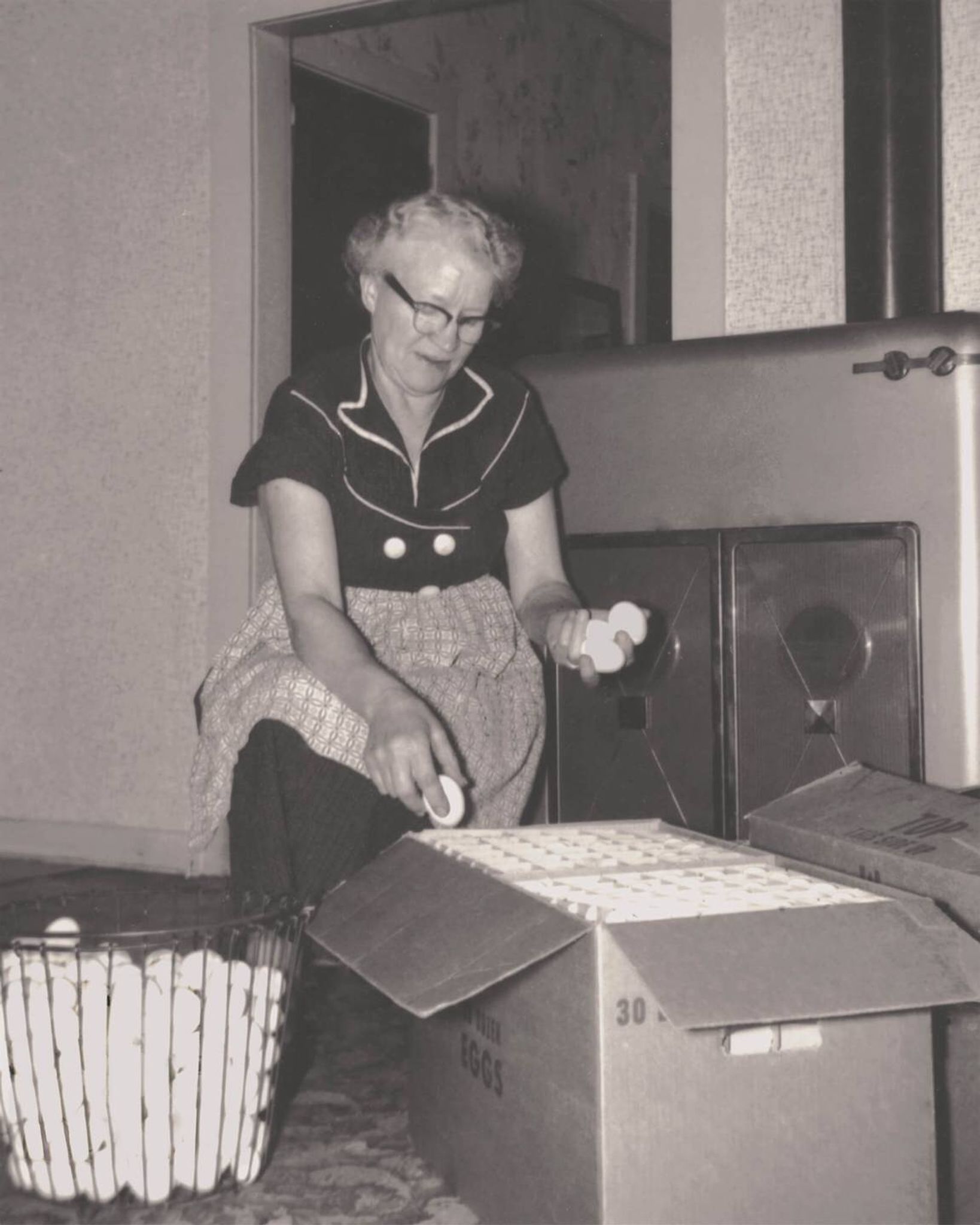 Ester Danielson cleaning eggs for market in Dassel, MN.