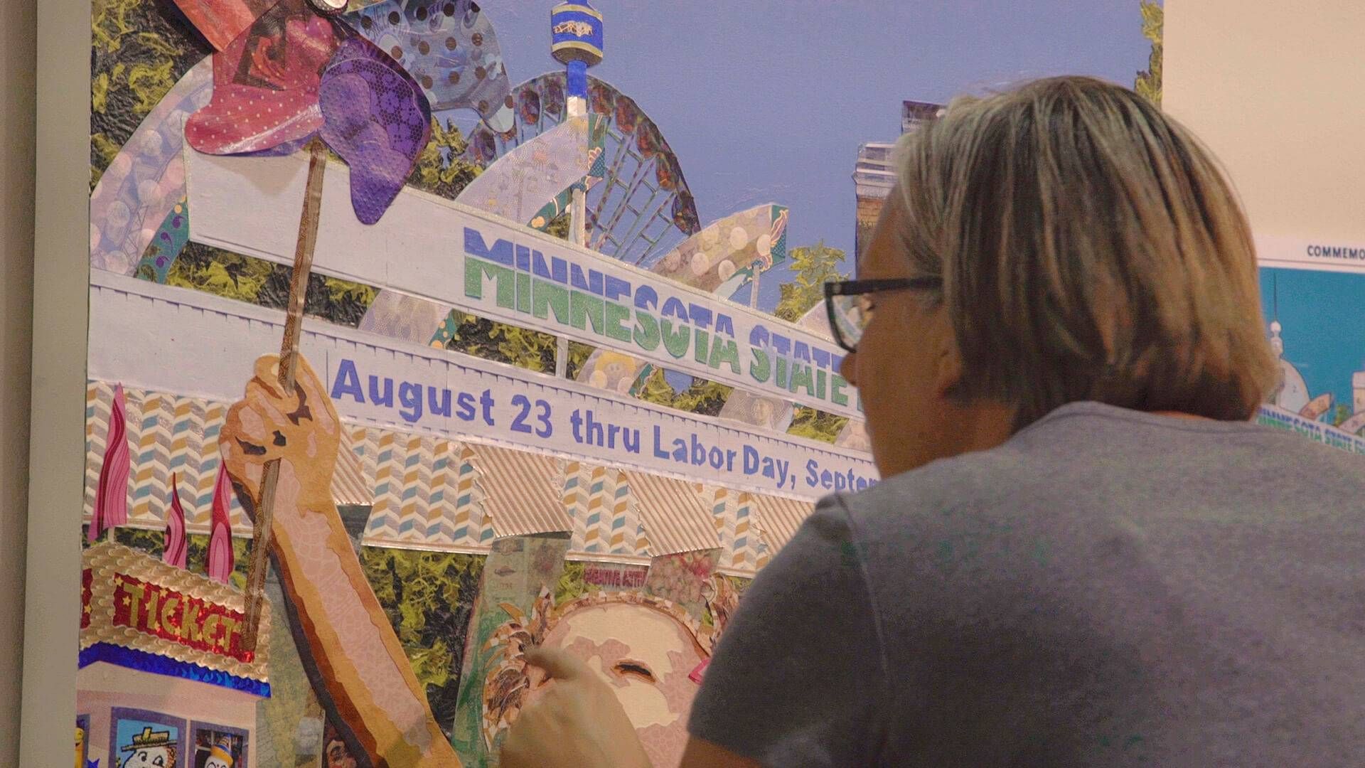 State Fair-Goer attempts to find all 50 hidden images of the State Fair in Kristi Abbott's 2018 Minnesota State Fair Commemorative Art.