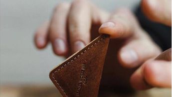 a person holding a chocolate bar