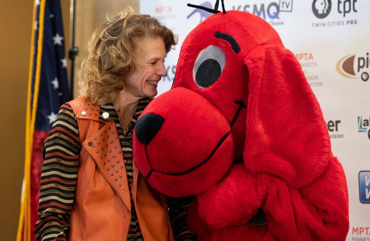 Senator Carrie Ruud snuggles with Clifford.