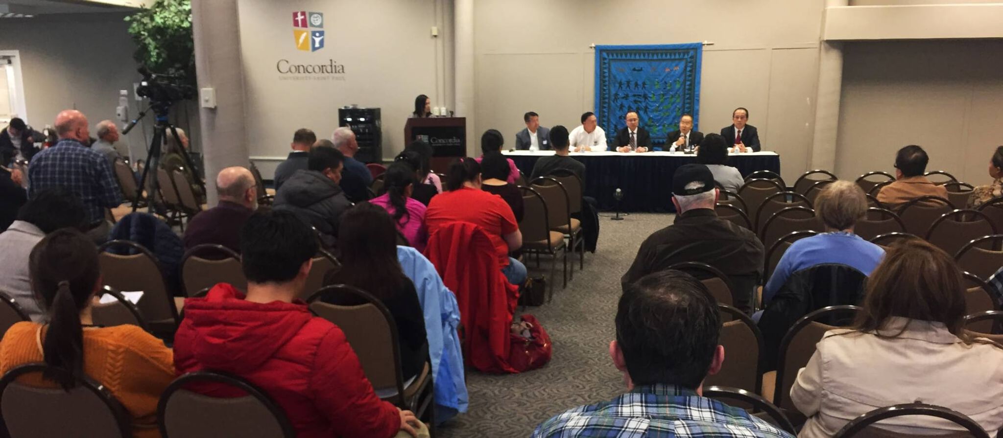 Audience listening to a panel speaking at an event